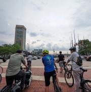 Baltimore Mayor Brandon Scott led a group of riders through the Inner Harbor on the way to City Hall.